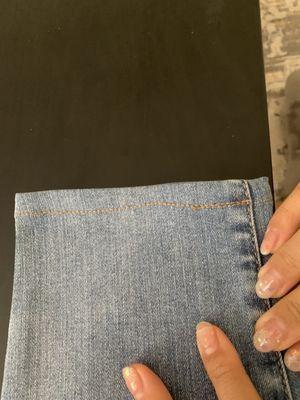 Uneven stitching. Not even in a straight line and for some reason there are two lines of stitching on the right side.