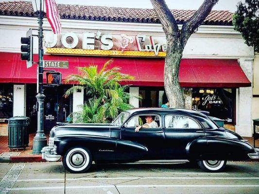 Joe driving his 1947 Cadillac fleetwood by joes cafe