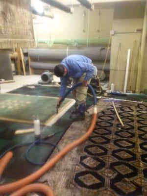 We take time in cleaning our rugs. Here is Chris taking special time just on the fringe...