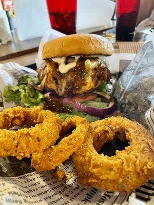 Specialty burger and onion rings