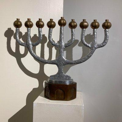 Silver hanukkiah with pomegranate candle holders by Oded Halamy