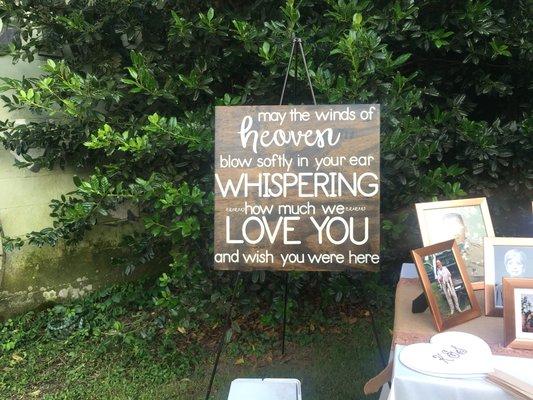 Memorial plaque and table at an outside wedding in the country.