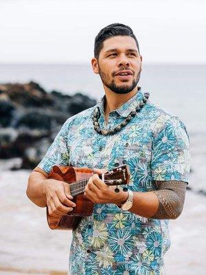 Something about strumming an ukulele at a beach on Maui.