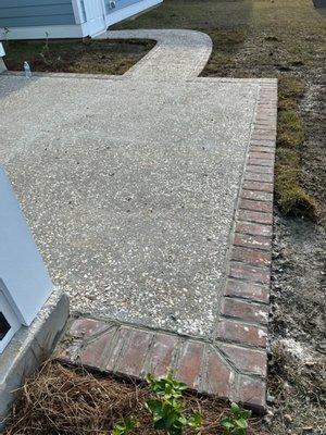 Tabby patio with paver border