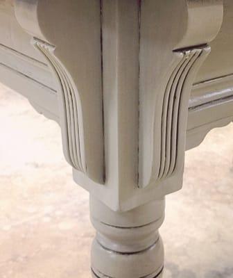 Closeup of antique table leg post renovation - painted/glazed.