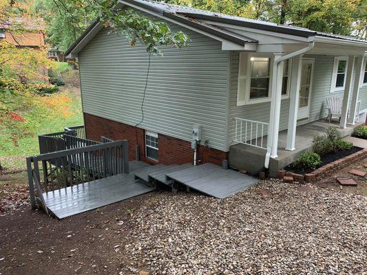 Pressure washing job of home receiving exterior and deck cleaning.