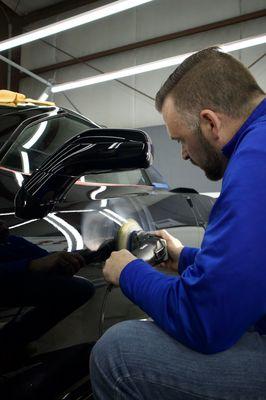 Derek the owner of The Shop Automotive Detailing performing a paint correction.