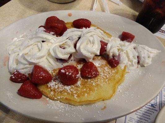 One... HUGE pancake with strawberries and cream