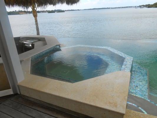 Glass mosaic on pool and jacuzzi