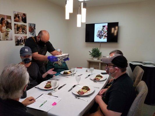 Clients being served select entrées during a scheduled tasting.