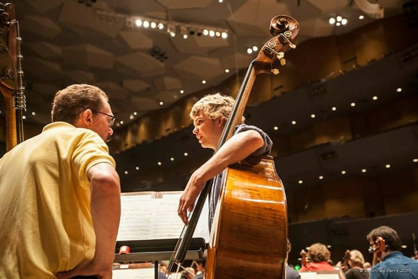 Bassist Bill Schrickel (left) works with a student. Photo by Courtney Perry