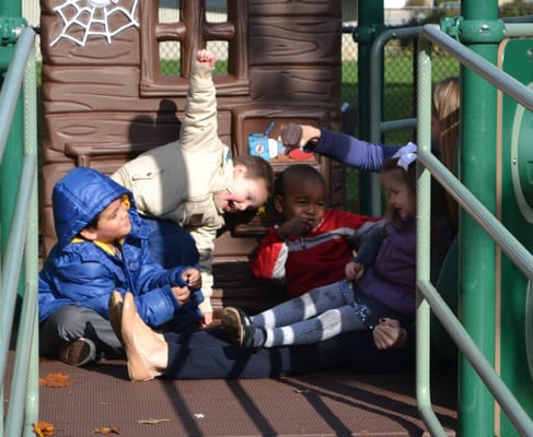 Young kids in daycare enjoy a new playground at the Post Avenue location.