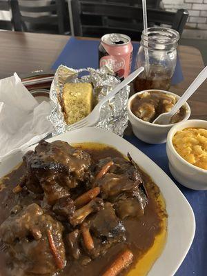 Smothered Oxtails, Mac & Cheese, Mashed Potatoes & Cornbread.