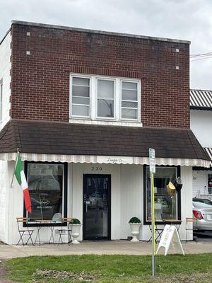 Luigis - view from the street- front door and bistro tables