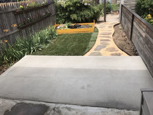 Concrete slab and stepping stone walk way