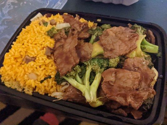 Beef and broccoli combo (pork egg roll not pictured). Meat was bland and served with yellow rice instead of fried white rice (weird).