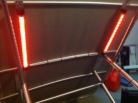 Overhead LED light tubes that switch from red to white.