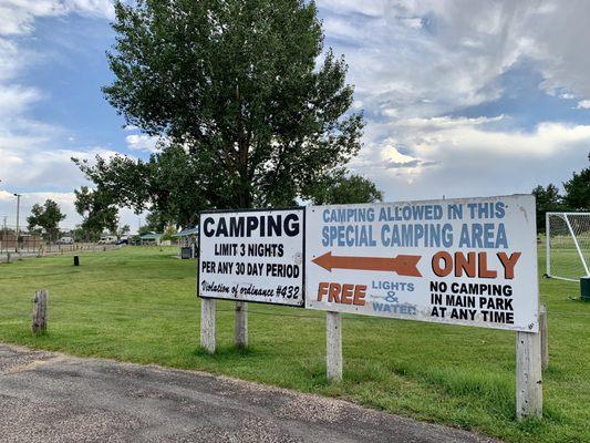 Signs and instructions for the designated camping area.