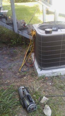 The new condensing unit with a new concrete pad. Very nice!