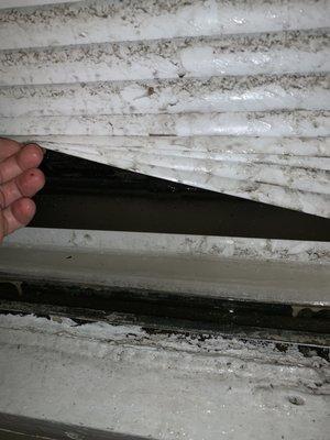 Ice with frozen blinds due to improper seal on window 1511 lagoon