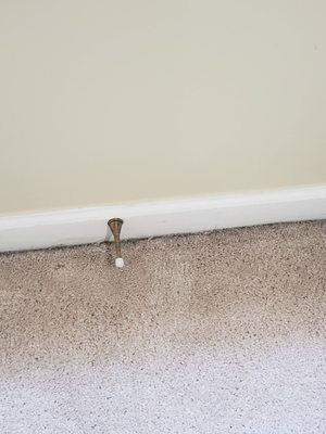 Dirt pushed to outer edges of carpet