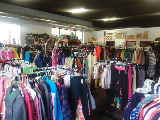 Picture from far corner of store. Children's Clothing from preemie to teen/Jr sizes and Maternity. Toys books games and more.