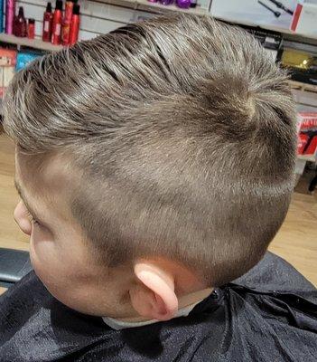 Tapered boy cut with a long side swoof