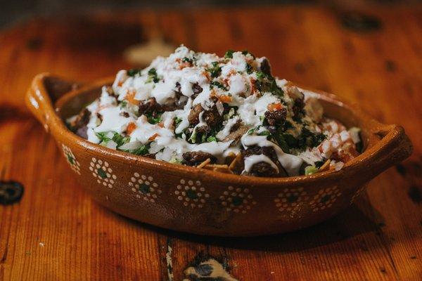 NACHOS $13
Bean paste, lettuce, chopped tomatoes, sour cream, cheese, meat of choice