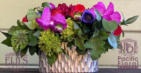 Jewel Toned Floral Arrangement, Royal Blue Vanda Orchids, Watermelon Pink Ranunculus, Red Anemones, Burgundy Dahlias, Mini Green Hydrangeas