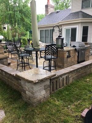 Beautiful paver patio and sitting walls custom built.