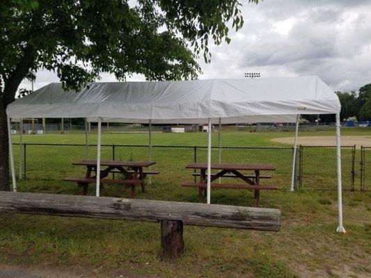 Covered picnic tables over looking base ball diamond