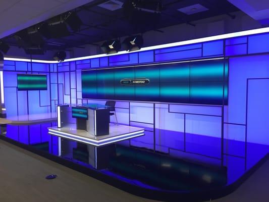 Led set Homestead tv news,plexiglass and led lights with a video wall