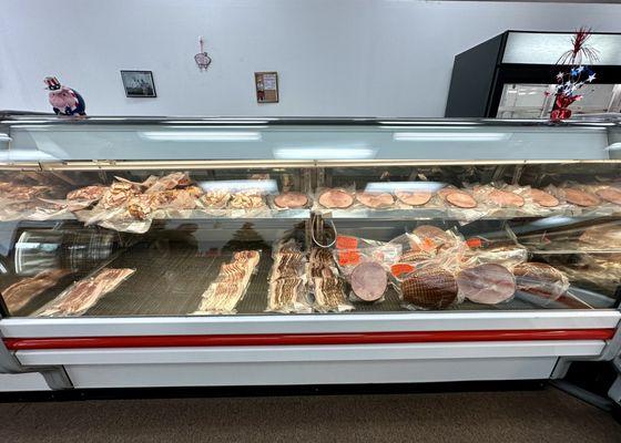 Display case of bacon and ham