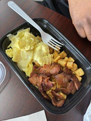 Breakfast Bowl with Scrambled Eggs, Potatoes, and Bacon.