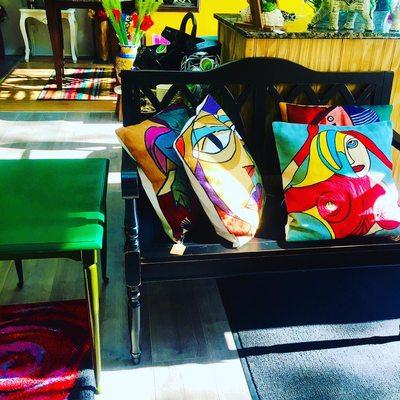 Bench with Picasso pillows Available today at Freedom Flower Boutique!