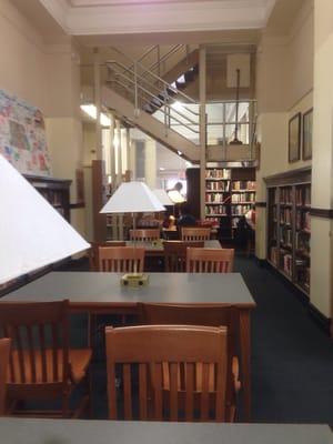 Main hall with 5 large study tables with outlets.