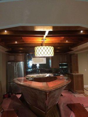 A converted boat to bar with LED pucklights lighting it up and fixture