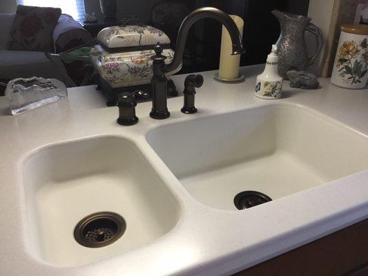 Put in faucets, with garbage disposal and drains, beautiful job!