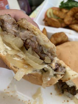 Juicy ribeye steak sandwich ! Omg it's so good done medium . Add grilled onion .