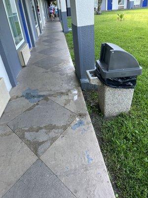 Ash trays and cigarette butts outside room