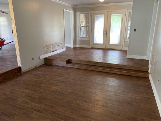 Custom steps and floating wood floor .