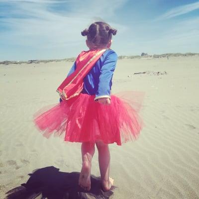 This is my lil super girl in the costume we purchased. It's very high quality and VERY well loved... She refused to take it off for a week.