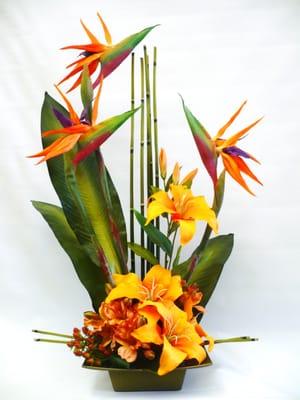 birds of paradise and lilies