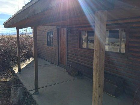 Sit and relax on the porch at a large cabin