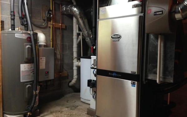 Geothermal replaces propane furnace and AC.  Also includes tankless hot water heater and humidifier.