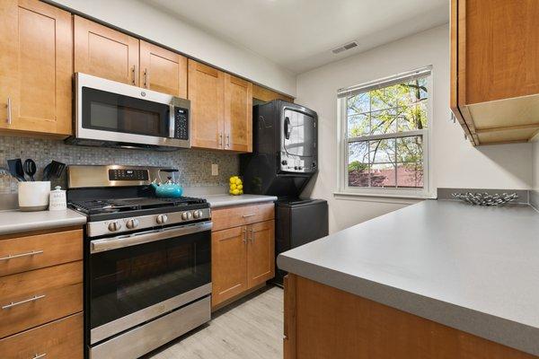 This is our contemporary kitchen style, complete with soft-close cabinetry, glass tile backsplash, and stainless steel appliances.