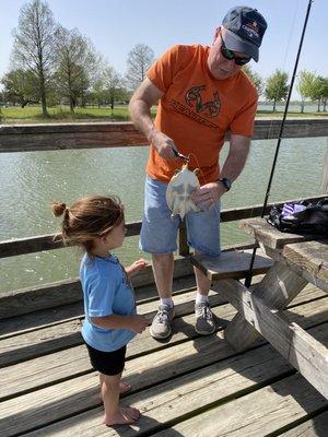 PaPaw and his side kick caught a turtle. She was really excited.