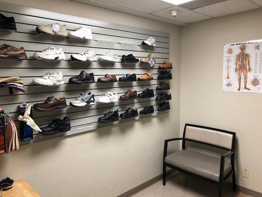 A patient room with displays of many of the diabetic and extra depth shoe options.