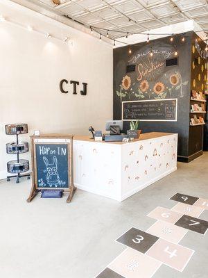 The new larger counter, decorated chalk wall, painted hopscotch for a little fun!