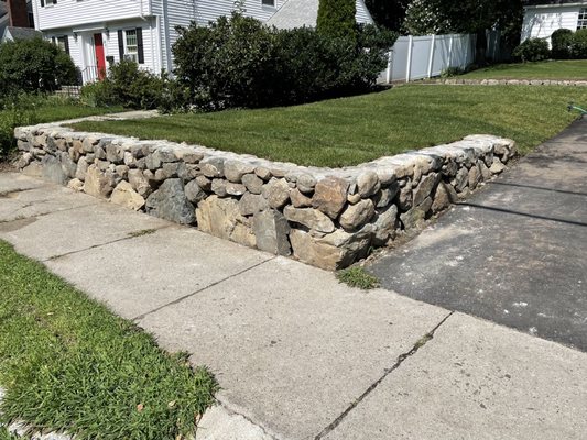 New rock wall and new sod.